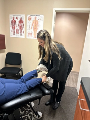 Chiropractor Virginia Beach VA Haley Cole Examining Patient